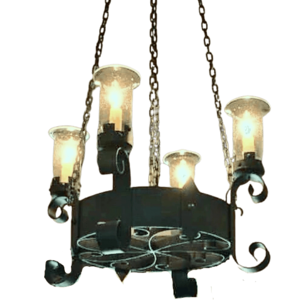 A decorative chandelier featuring four glass candle-style lights on an intricately designed wrought iron frame, accented with elegant scrollwork and hanging chains.