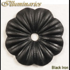 A decorative black iron accent featuring a floral design with curved petals and a central hole, perfect for enhancing wrought iron lighting fixtures.