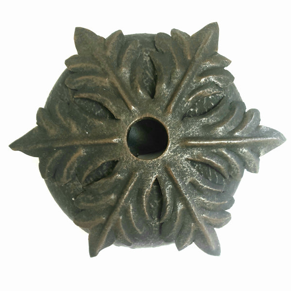 An intricately designed wrought iron fixture featuring a leaf motif and ornate detailing, designed to add elegance to any space. Ideal for custom lighting projects.