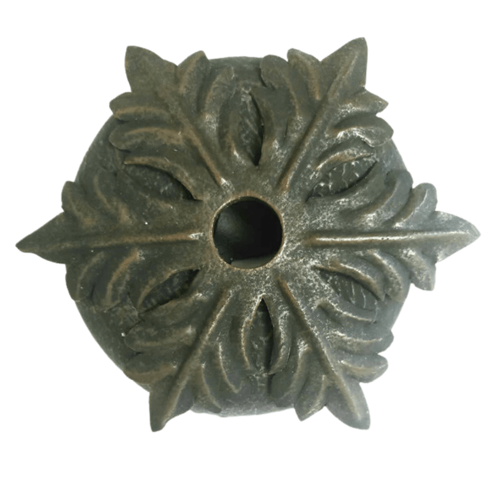 Ornate wrought iron fixture detail featuring intricate leaf and floral patterns. Center hole designed for easy installation, showcasing craftsmanship.