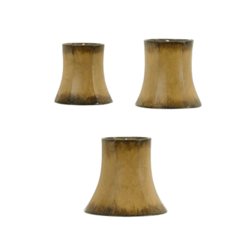 Three unique light shade designs characterized by a bell shape, featuring a warm, golden-brown finish with subtle gradients. Ideal for enhancing wrought iron fixtures.