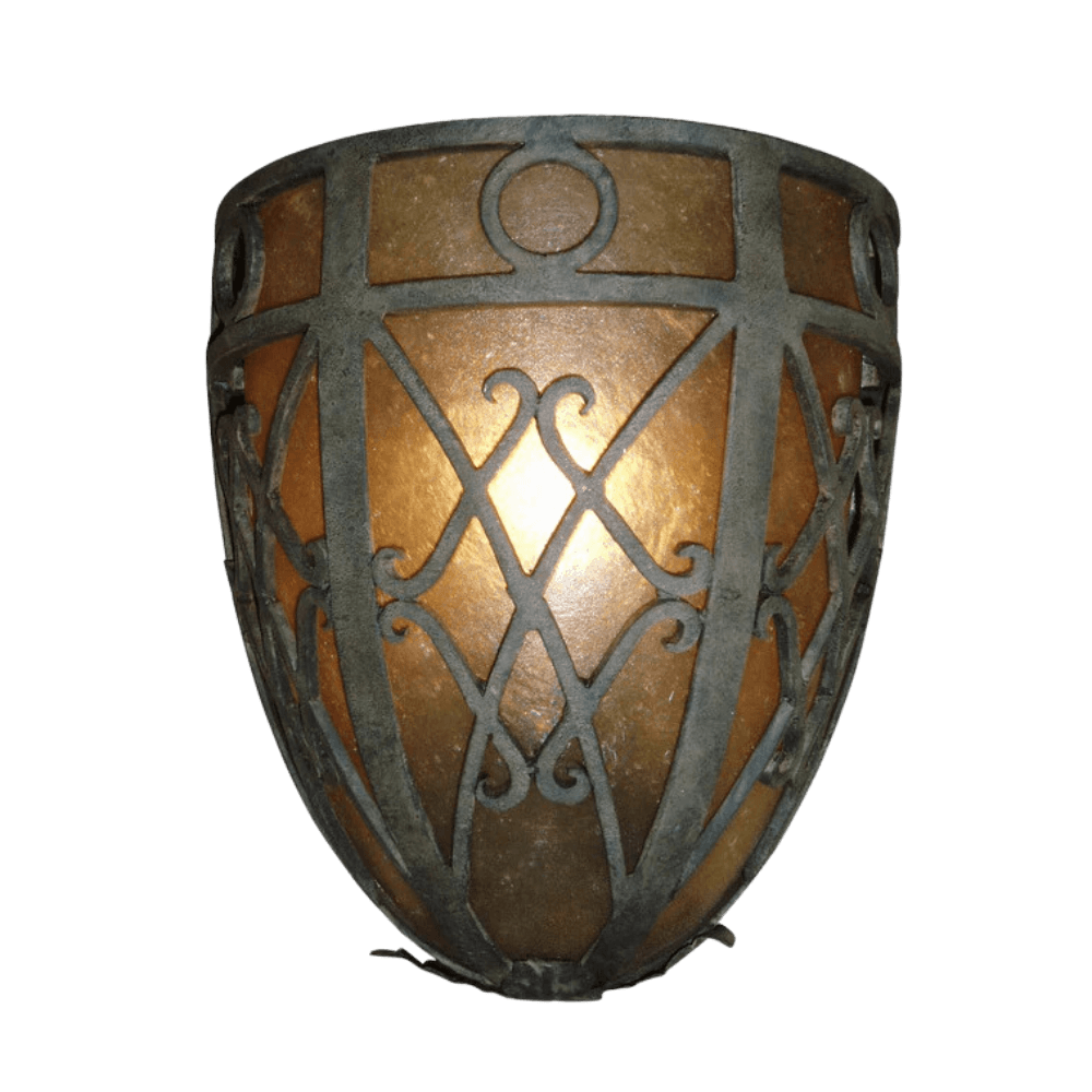 A beautifully crafted wrought iron sconce featuring intricate metalwork and warm amber glass, creating a cozy, inviting glow.