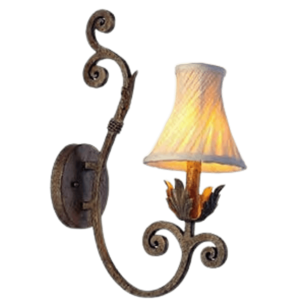 A decorative wall sconce featuring an ornate wrought iron design with elegant curves. It showcases a soft, pleated shade that emits warm light, complemented by leafy accents at the base, adding a touch of classic charm to any space.
