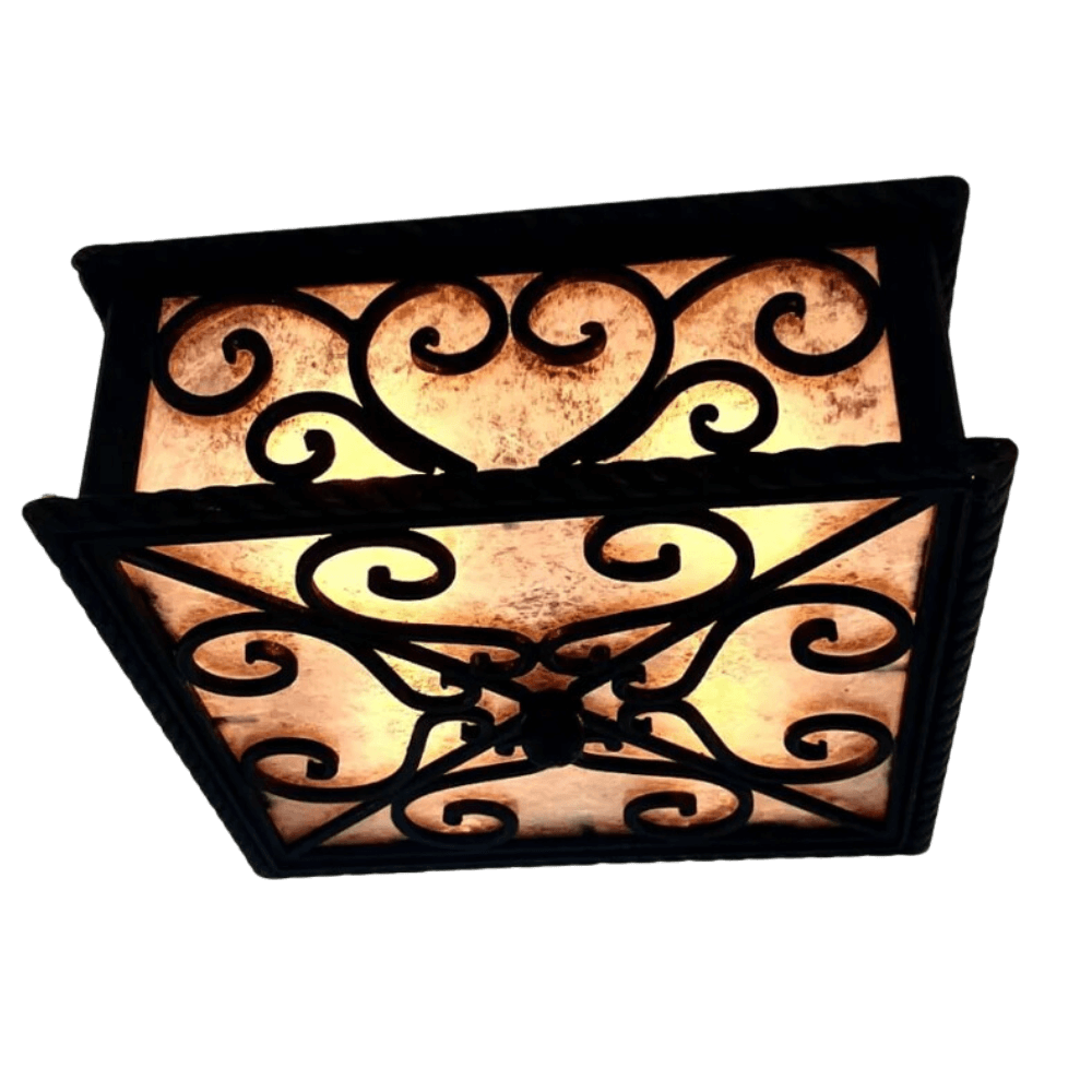 A decorative ceiling fixture with intricate wrought iron detailing and warm, glowing glass panels. The design features elegant swirls and a geometric pattern, creating an inviting ambiance for any space.