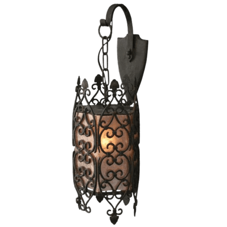 A decorative wrought iron sconce featuring intricate scrollwork and a warm, glowing inner light. The design showcases stylish curves and a classic aesthetic, perfect for enhancing any space with elegance.