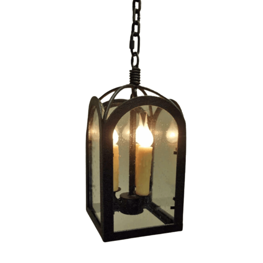 A stylish pendant light featuring a classic design with arched glass panels and candle-style bulbs, perfect for adding warmth and elegance to any space.