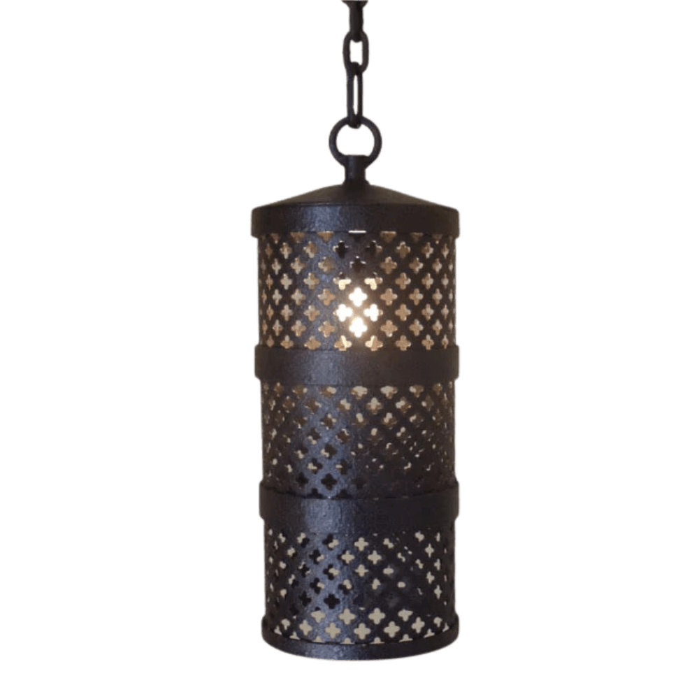 A cylindrical pendant light crafted from wrought iron, featuring intricate cut-out patterns that allow warm light to glow softly through. The fixture is suspended by a matching chain, adding an elegant touch to any space.