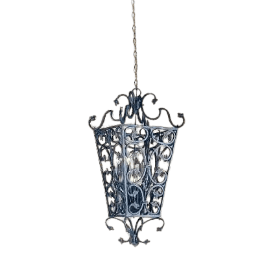 Intricately designed wrought iron pendant featuring a decorative pattern and open framework, showcasing the light source inside. Perfect for enhancing rustic or traditional interiors.