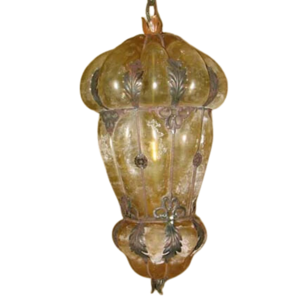 A beautifully crafted pendant light featuring a decorative, curved glass shade with intricate iron detailing. The warm hues and ornate design add elegance to any space, enhancing the ambiance with its unique charm.