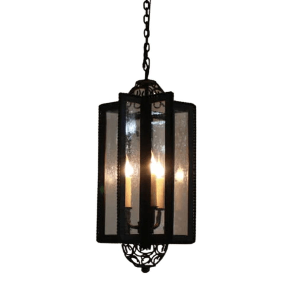A hanging pendant light featuring a rectangular frame with vertical bars and clear glass panels, showcasing flickering candle-style bulbs. The bottom includes ornate detailing for added elegance, perfect for enhancing interior spaces.