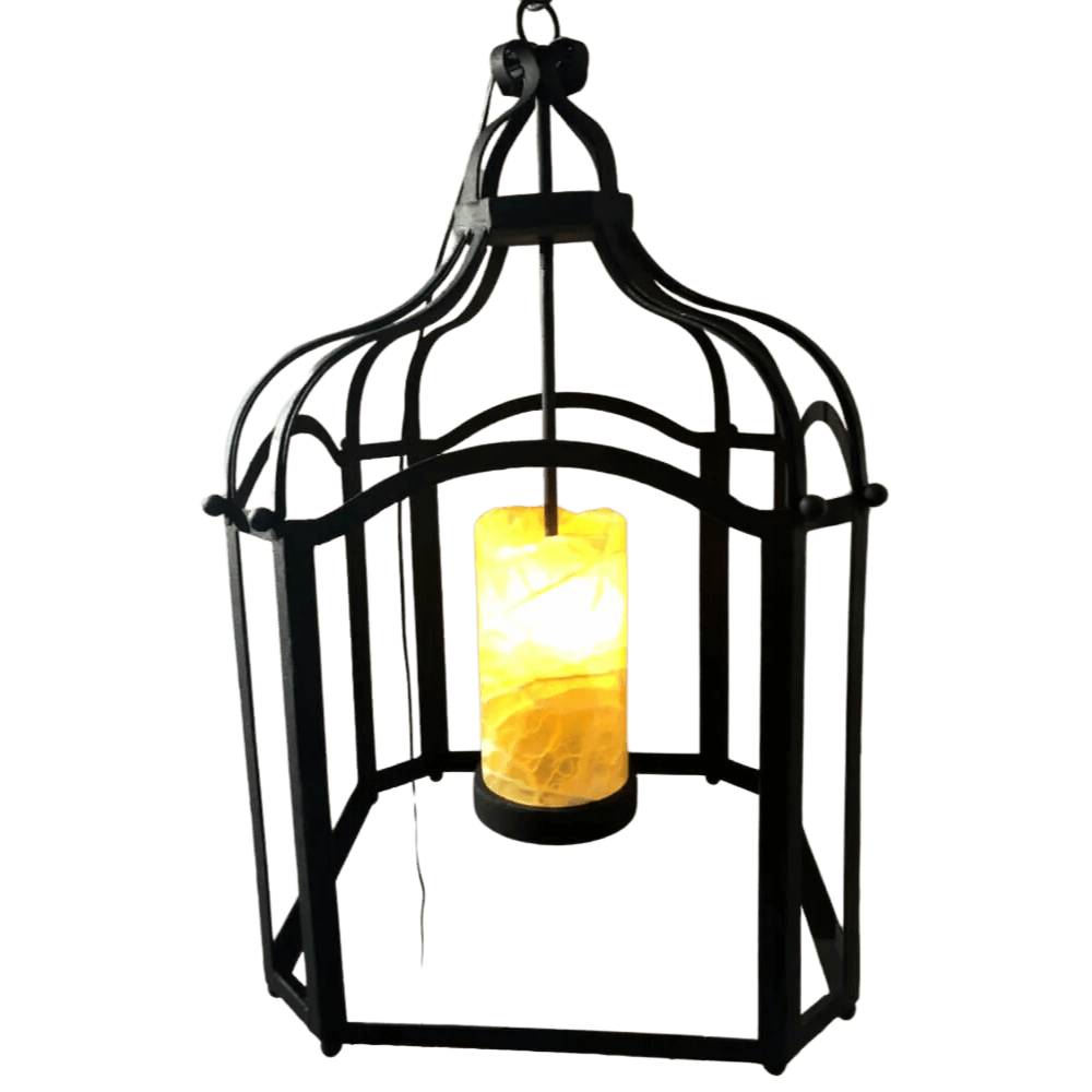 A decorative wrought iron pendant featuring an arched design with intricate detailing. Inside, a warm, glowing candle creates a cozy ambiance, perfect for enhancing any space.