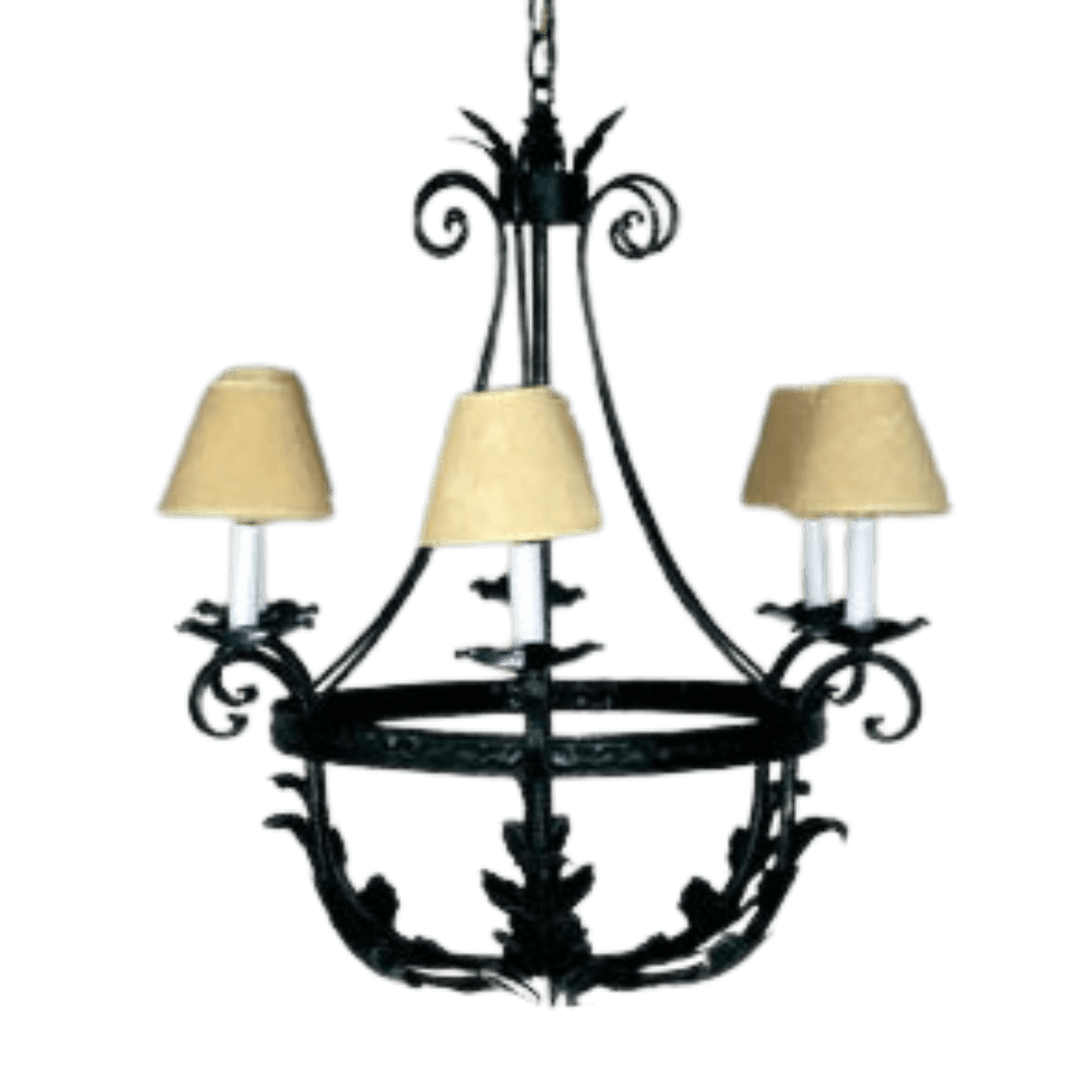 A beautifully crafted wrought iron chandelier featuring ornate curves and leaf designs. It holds three candle-style lights topped with soft, beige shades, perfect for adding elegance and warmth to any space.