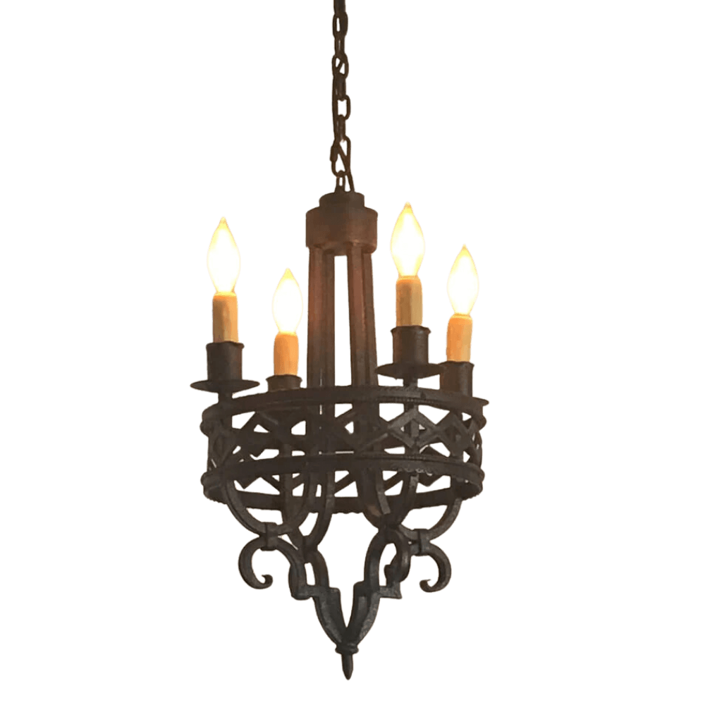 A decorative wrought iron chandelier featuring intricate scrollwork and five candle-style lights. The fixture combines rustic charm with elegance, suitable for enhancing any indoor space.
