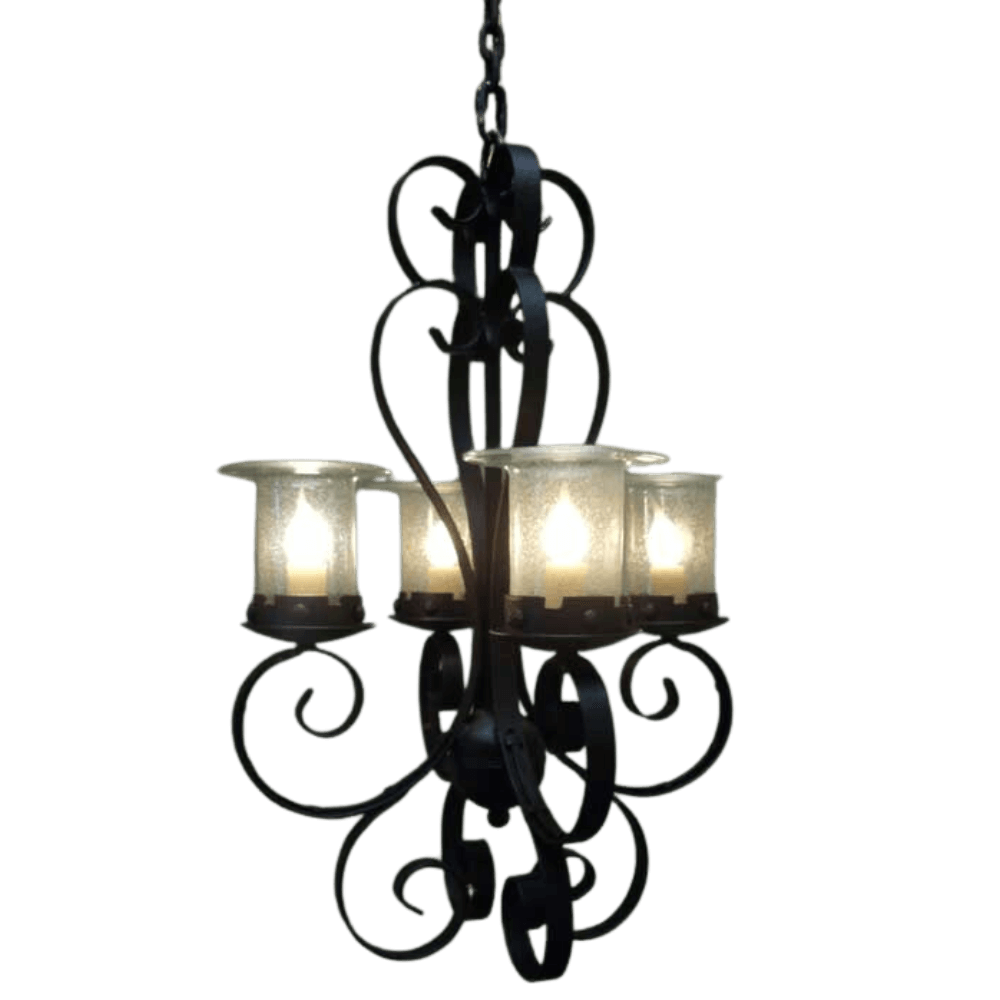 A beautifully crafted chandelier featuring intricate wrought iron scrollwork and four elegant glass candle holders, each illuminated with soft light, creating a warm and inviting ambiance.