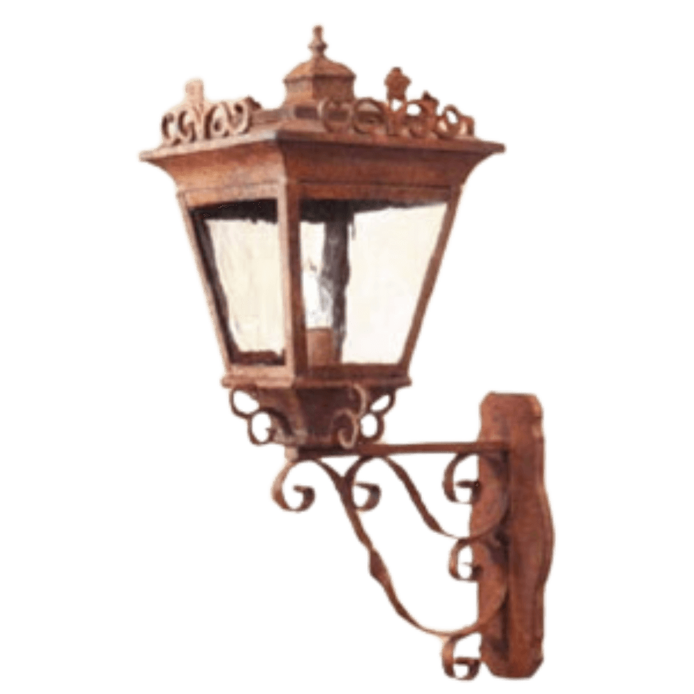 A decorative wall-mounted fixture featuring intricate wrought iron detailing with a charming lantern shape. The design showcases elegant scrollwork and clear glass panels, providing a warm, inviting glow. Ideal for enhancing outdoor spaces or entryways.