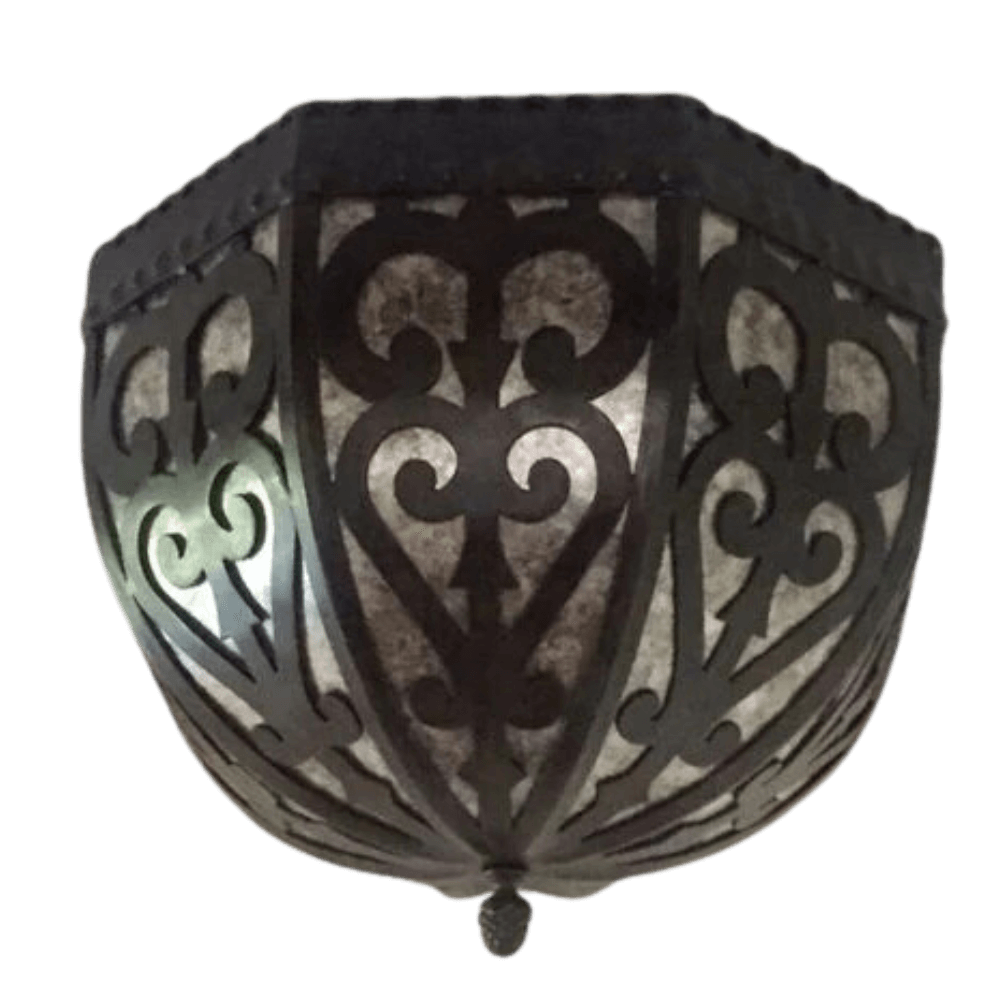A beautifully crafted wrought iron sconce featuring intricate, swirling designs. The dark metalwork contrasts elegantly with the muted light filtering through, creating a warm and inviting glow. This fixture adds a touch of rustic charm and artistic flair to any interior space.