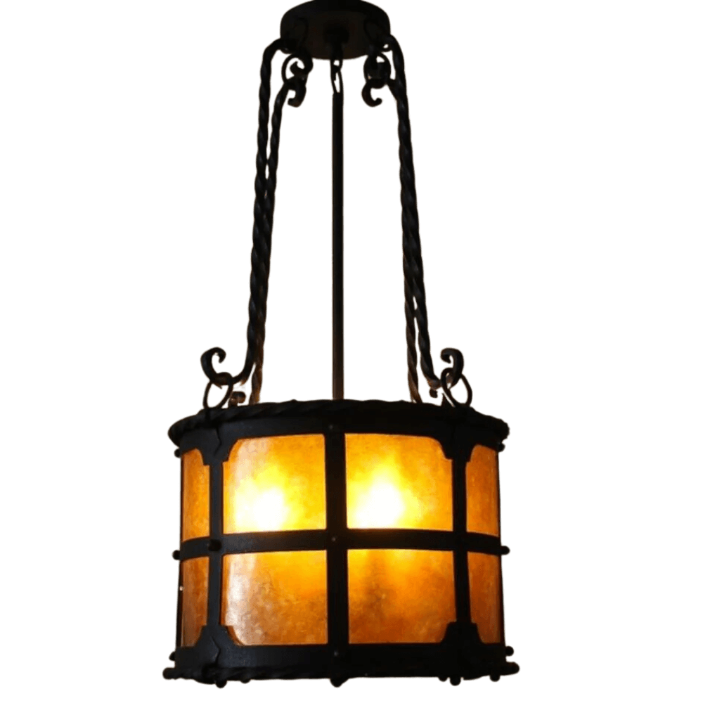 Delicate wrought iron pendant light with a warm amber glow, featuring an intricate cage design and decorative details, perfect for enhancing any space.