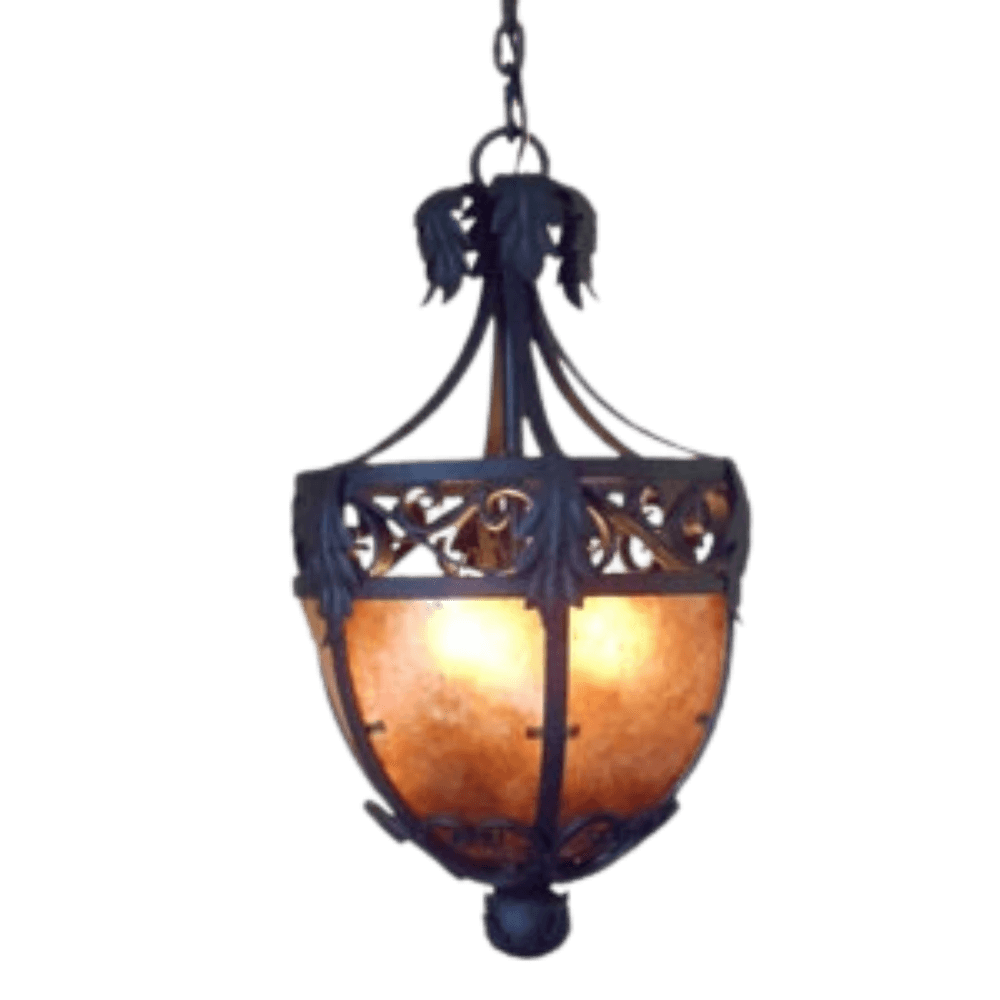 Intricate wrought iron pendant featuring ornate detailing, accented by a warm amber shade, casting inviting light in any space.