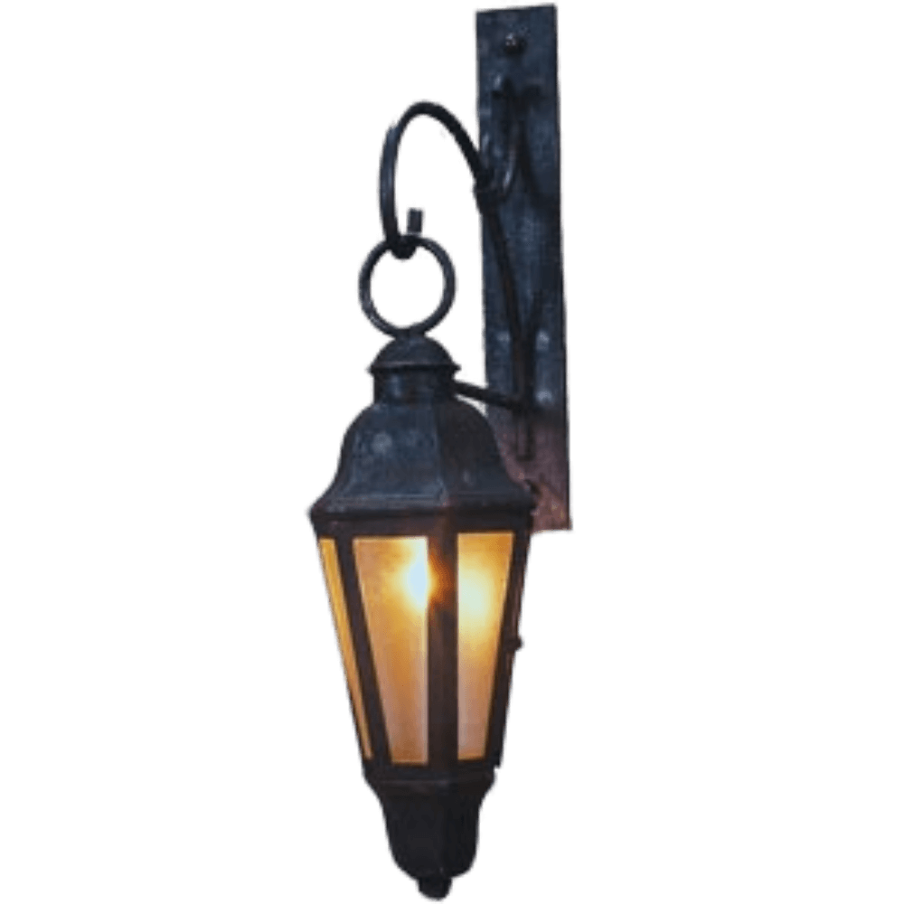 A decorative wrought iron wall sconce featuring a classic lantern design with amber glass panels. The fixture showcases intricate detailing, adding warmth and charm to any space.