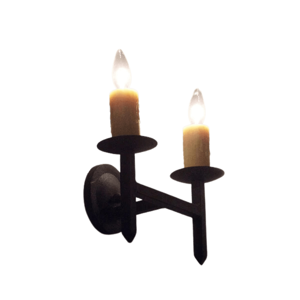 A classic wrought iron wall sconce featuring two candle-style lights. The fixture has a rustic black finish, perfect for adding warmth and elegance to any space.
