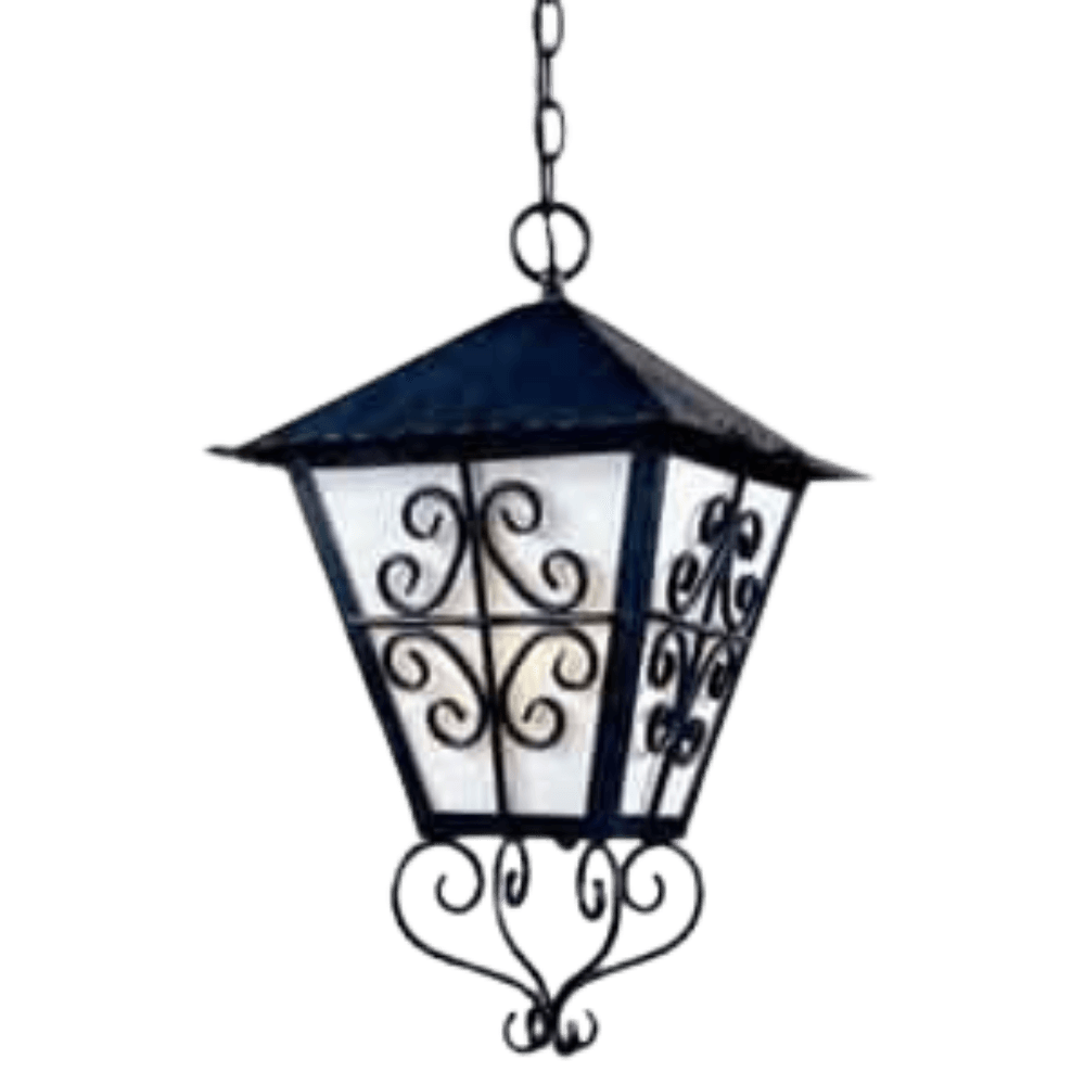 A decorative pendant light featuring intricate wrought iron scrollwork and a multi-faceted glass design. The metal shade has a peaked roof and elegant detailing, creating a warm, inviting ambiance.