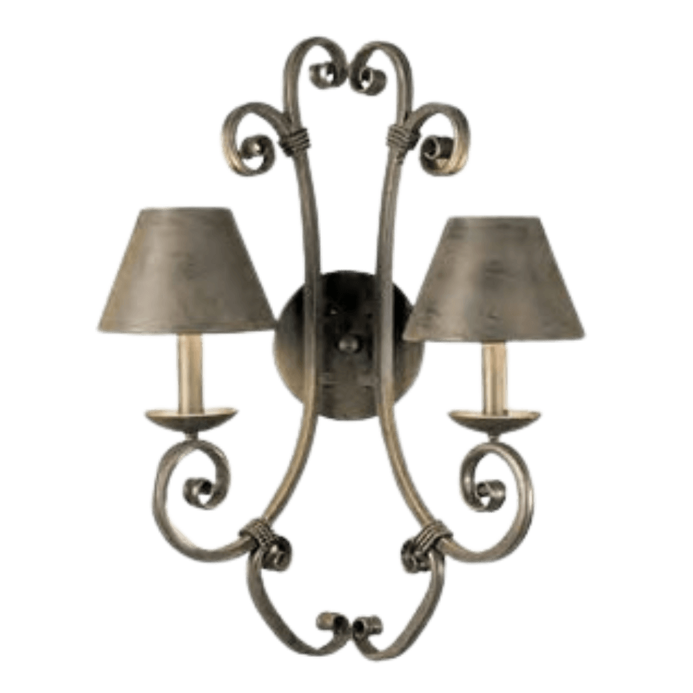 A decorative wall sconce featuring two elegant, curved arms supporting conical shades. The intricate scrolling design adds artistic flair, creating a warm and inviting ambiance perfect for enhancing interior spaces.