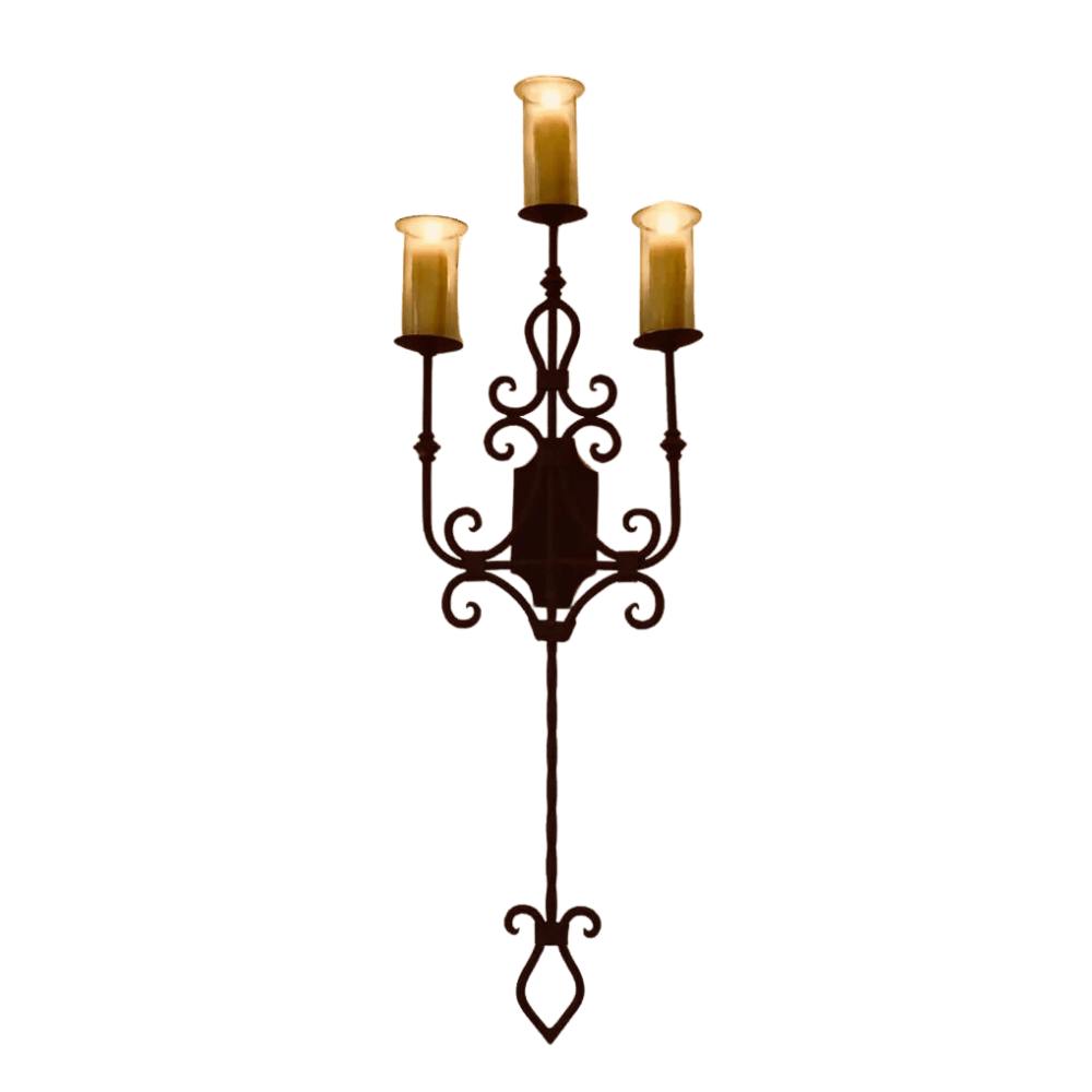 A decorative wrought iron wall sconce featuring three candle-style lights atop intricate scrolling details. The elegant design enhances any space with a warm, inviting glow.