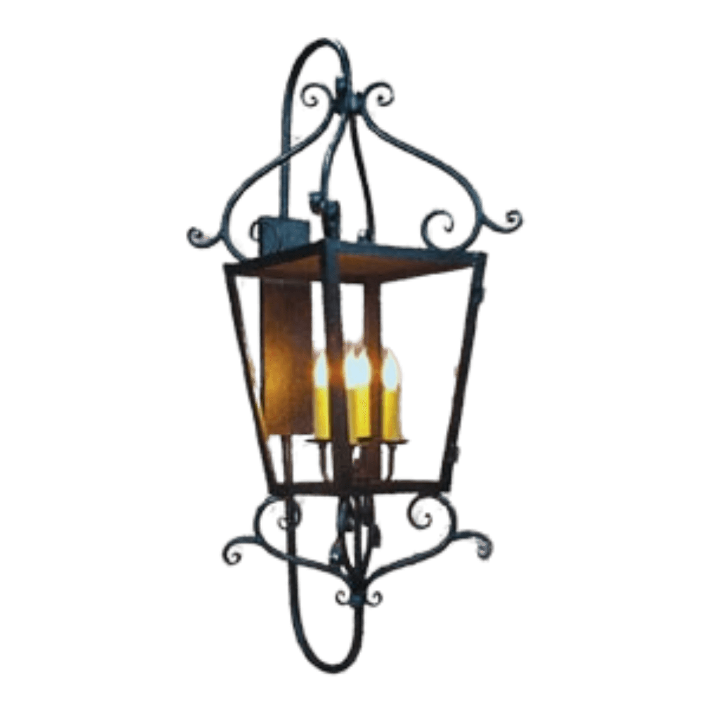 A beautifully crafted wall sconce featuring intricate wrought iron detailing, housing three elegant candle-style lights. The ornate design adds a timeless charm and warmth to any space.