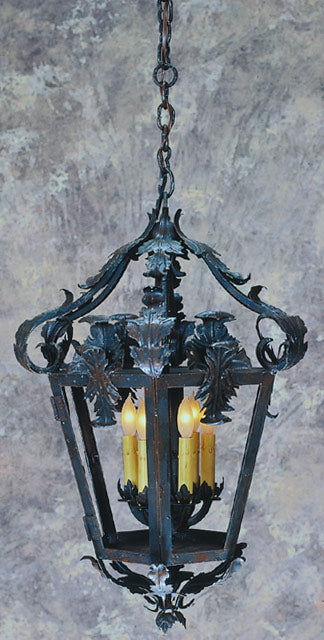 A beautifully crafted wrought iron chandelier featuring intricate leaf designs. The fixture includes four candle-style lights, suspended from an ornate chain, ideal for adding a touch of elegance to any space.