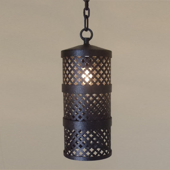 A decorative pendant light featuring intricate cut-out designs, highlighting a warm glow from the central light source. The fixture combines elegance with a vintage charm, perfect for enriching any living space.