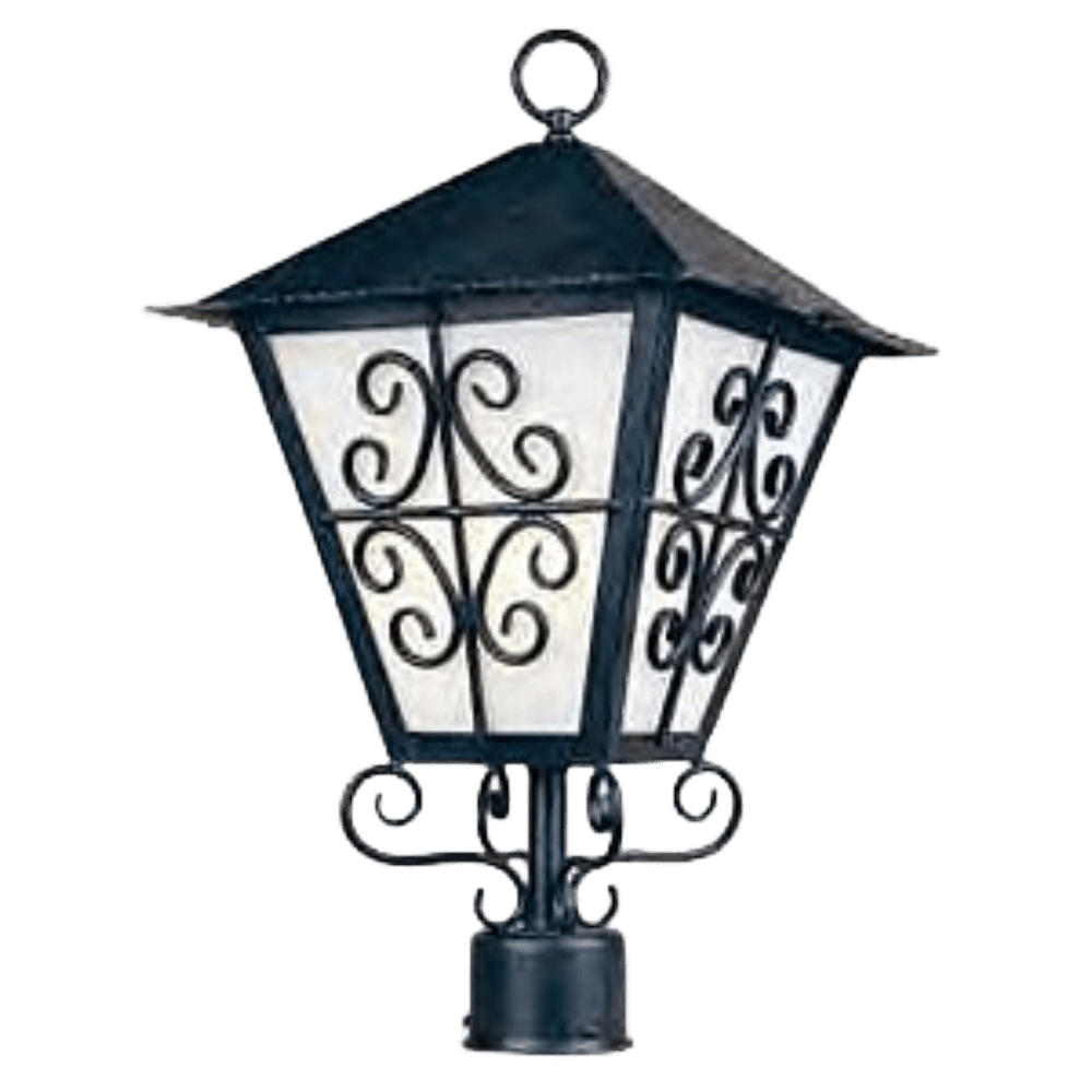 A decorative wrought iron sconce featuring a peaked roof and intricate scrollwork, with frosted glass panels illuminating softly.