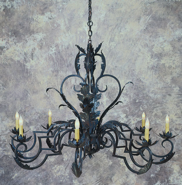 A beautifully crafted wrought iron chandelier featuring intricate leaf designs and six candle-style lights. The fixture showcases elegant curves and a dark finish, adding a touch of sophistication to any space.