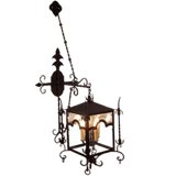 Intricately designed pendant featuring a square metal frame with ornate scrollwork, holding three candle-style lights, perfect for adding elegance to any space.