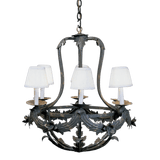 A beautifully crafted wrought iron chandelier featuring elegant leaf detailing and four light sources. The design is complemented by white fabric lampshades, adding a touch of sophistication. Perfect for enhancing any space with its artistic flair.