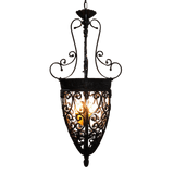 A beautifully crafted wrought iron pendant features intricate swirling designs and a warm glowing light source. The elegant shape enhances any space with its vintage charm.