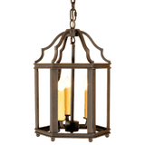 A beautifully crafted wrought iron pendant featuring an elegant design with a decorative top and four candle-like lights. The fixture is framed with intricate detailing, combining classic charm with a warm glow, ideal for enhancing any living space.