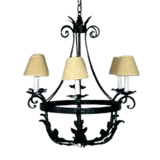 A beautifully crafted wrought iron chandelier featuring ornate curves and leaf designs. It holds three candle-style lights topped with soft, beige shades, perfect for adding elegance and warmth to any space.