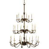 A sophisticated wrought iron chandelier with multiple tiers and elegantly curved arms, featuring candle-like lights that create a warm and inviting ambiance.