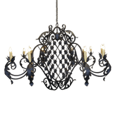 Elegantly crafted chandelier featuring intricate wrought iron designs, with eight candle-style lights. The ornate detailing and flowing curves add a touch of sophistication and warmth to any space.