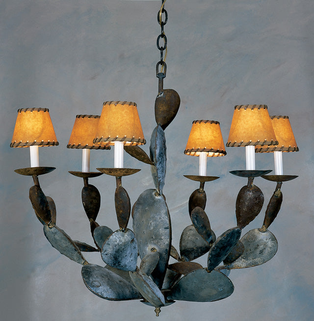A unique wrought iron chandelier featuring an organic design with leaf-like elements. It has six warm-toned fabric shades, creating a cozy ambiance. The intricate details and rustic finish add character, making it a striking centerpiece for any room.